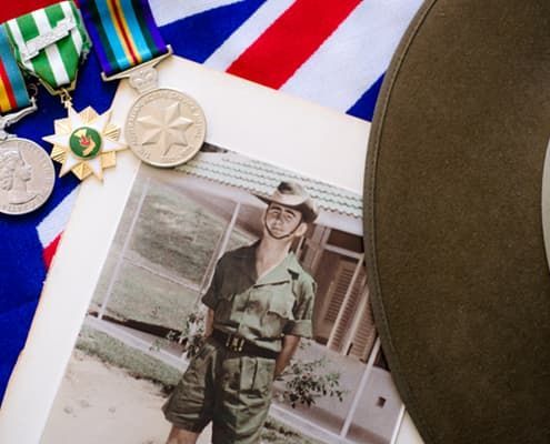 A picture of a man in a military uniform with medals and a hat - Funeral Services in Upper Coomera, QLD