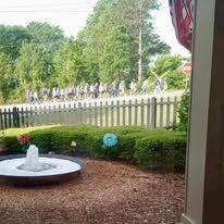 There is a fountain in the middle of the yard.
