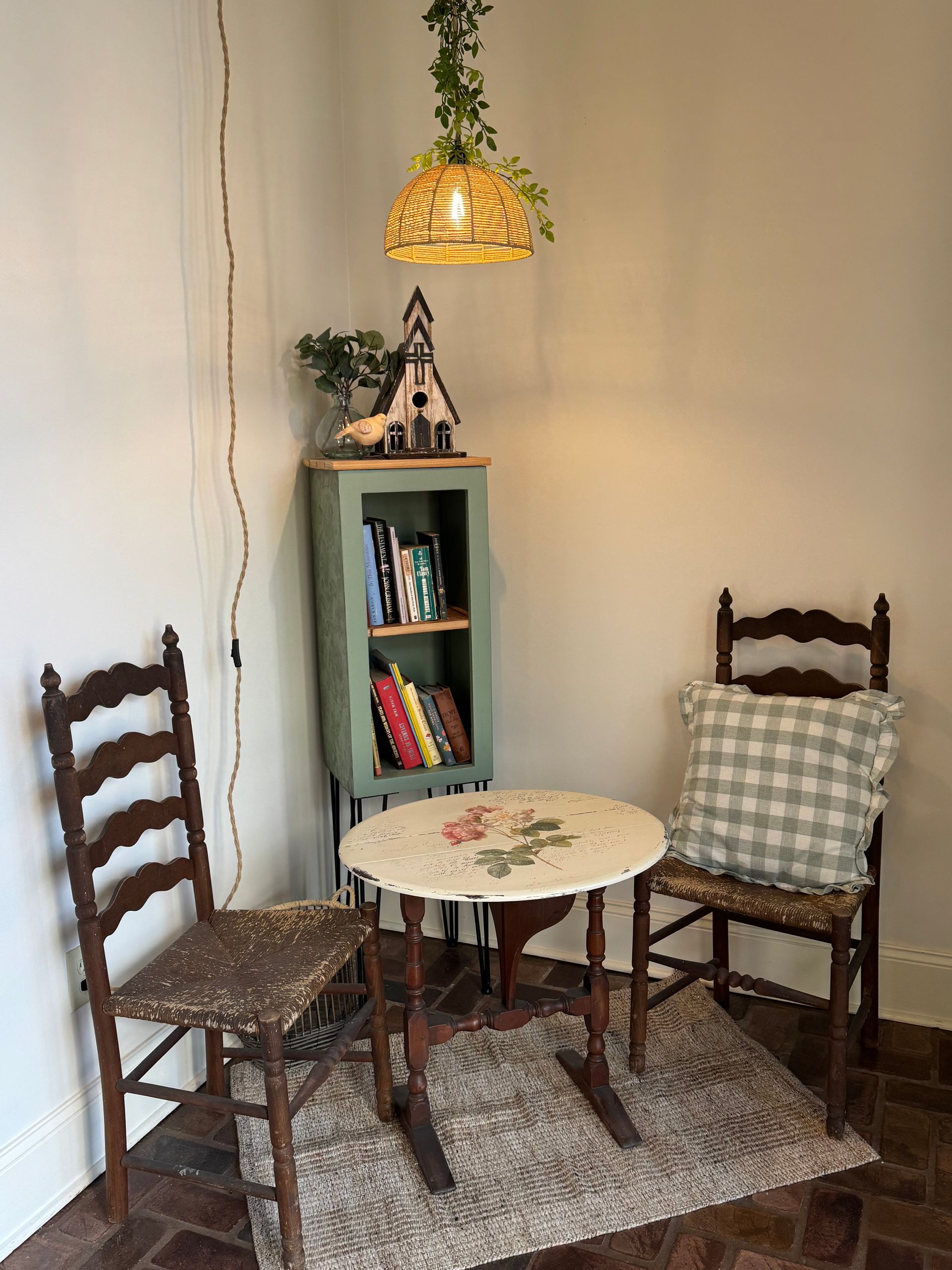 There is a table and chairs in the corner of the room.