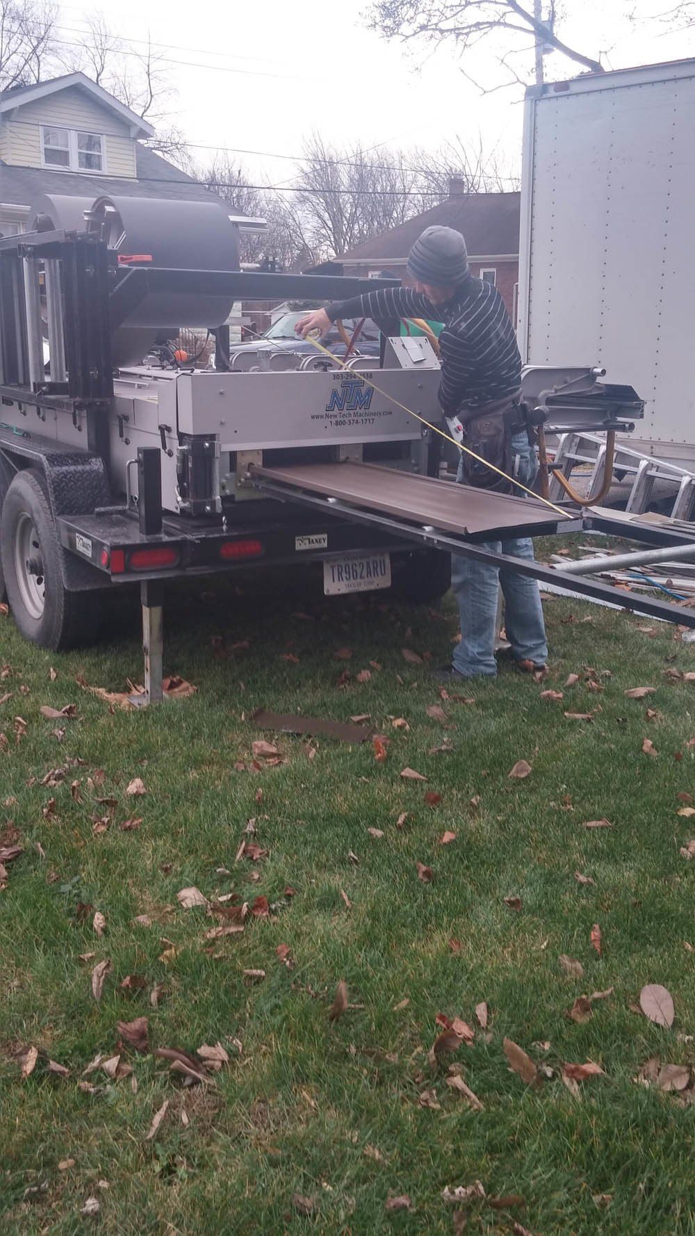 Rolling out steel for roof in Crown Point IN