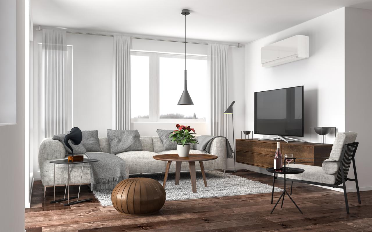 A living room with a couch , chair , table and television.