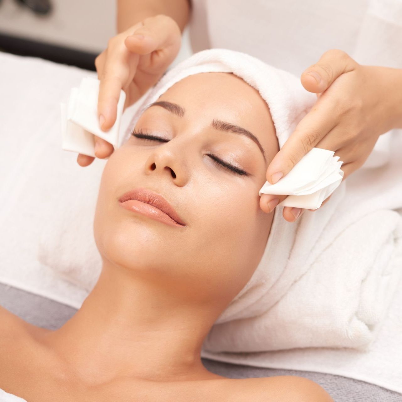 attractive woman receiving face beauty procedures
