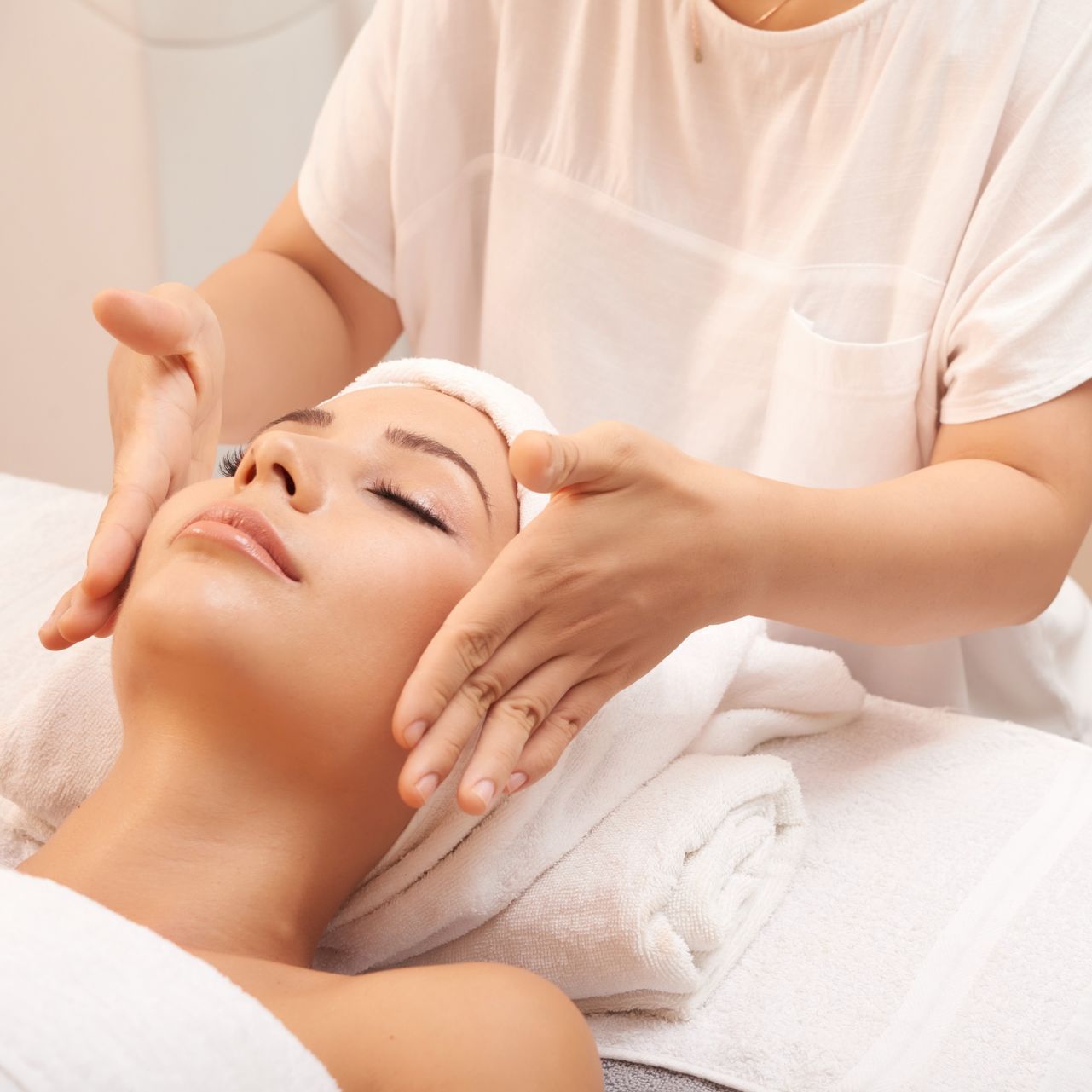 young caucasian woman receiving anti age massage treatment