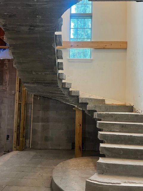 Concrete circular stairway without limestone facing