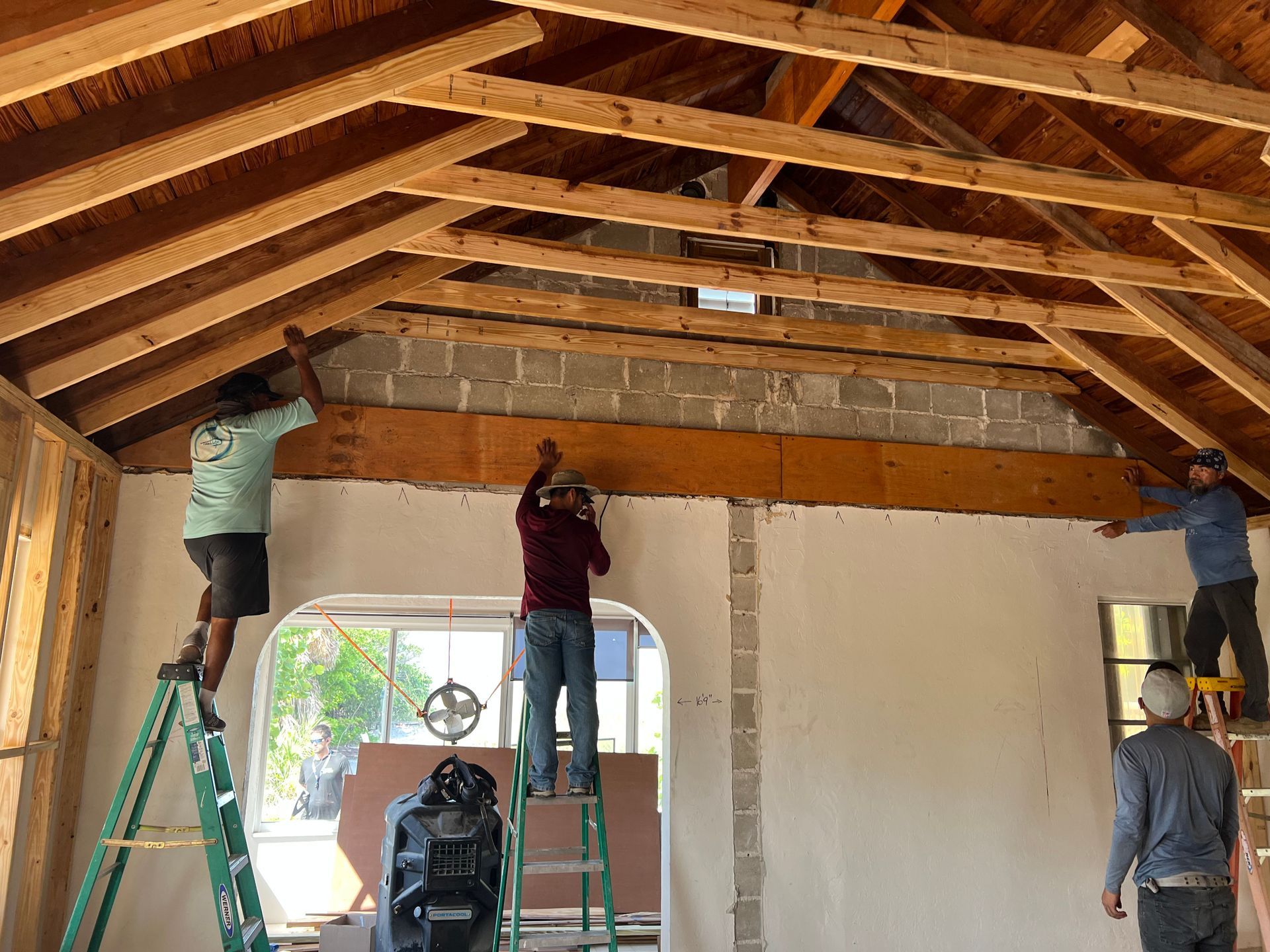 Carpenters working on vaulted ceiling