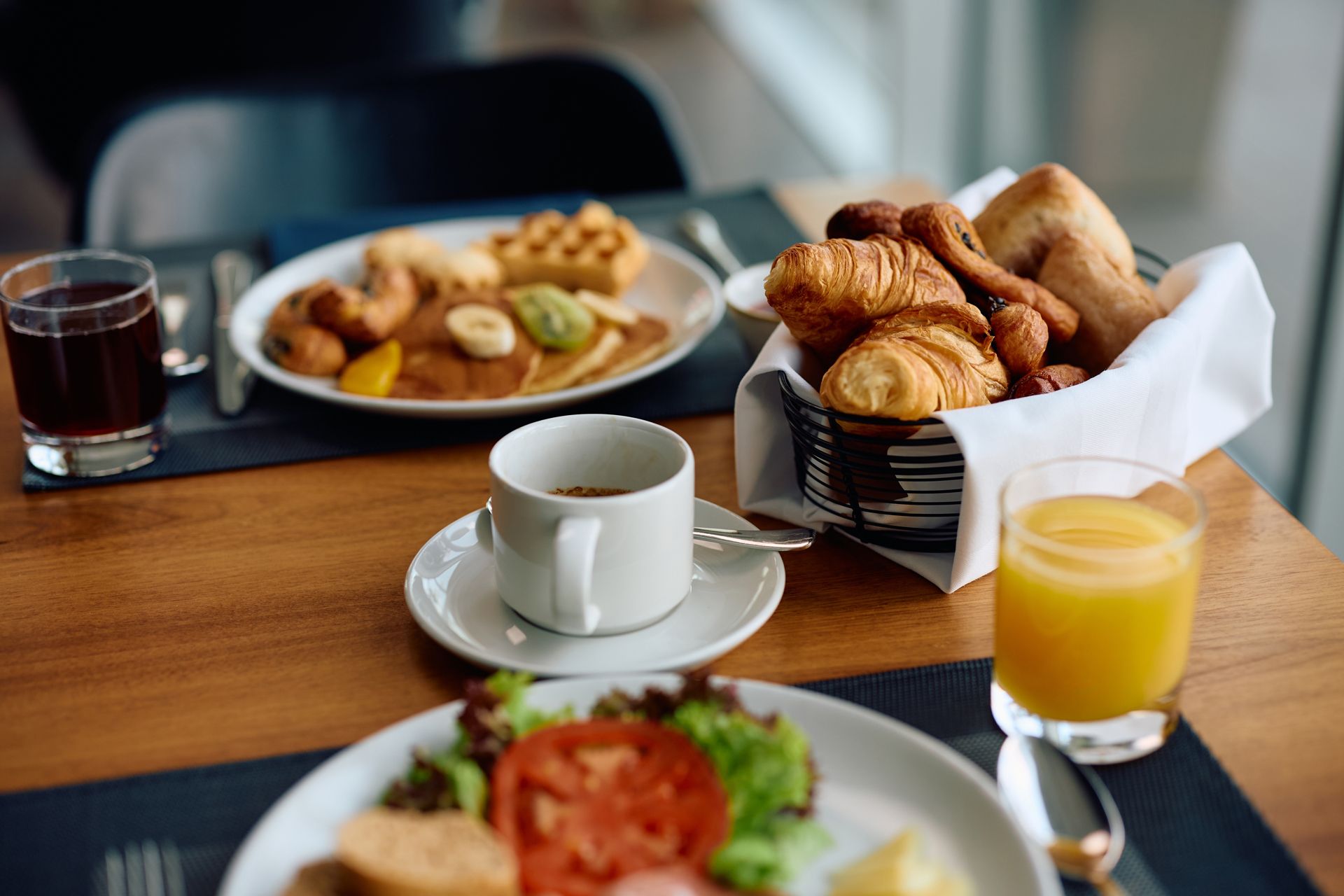 A Table Topped With Plates of Food