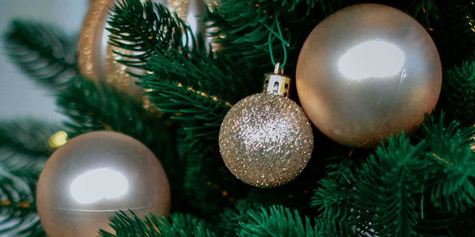 Christmas tree decorated with gold ornaments.