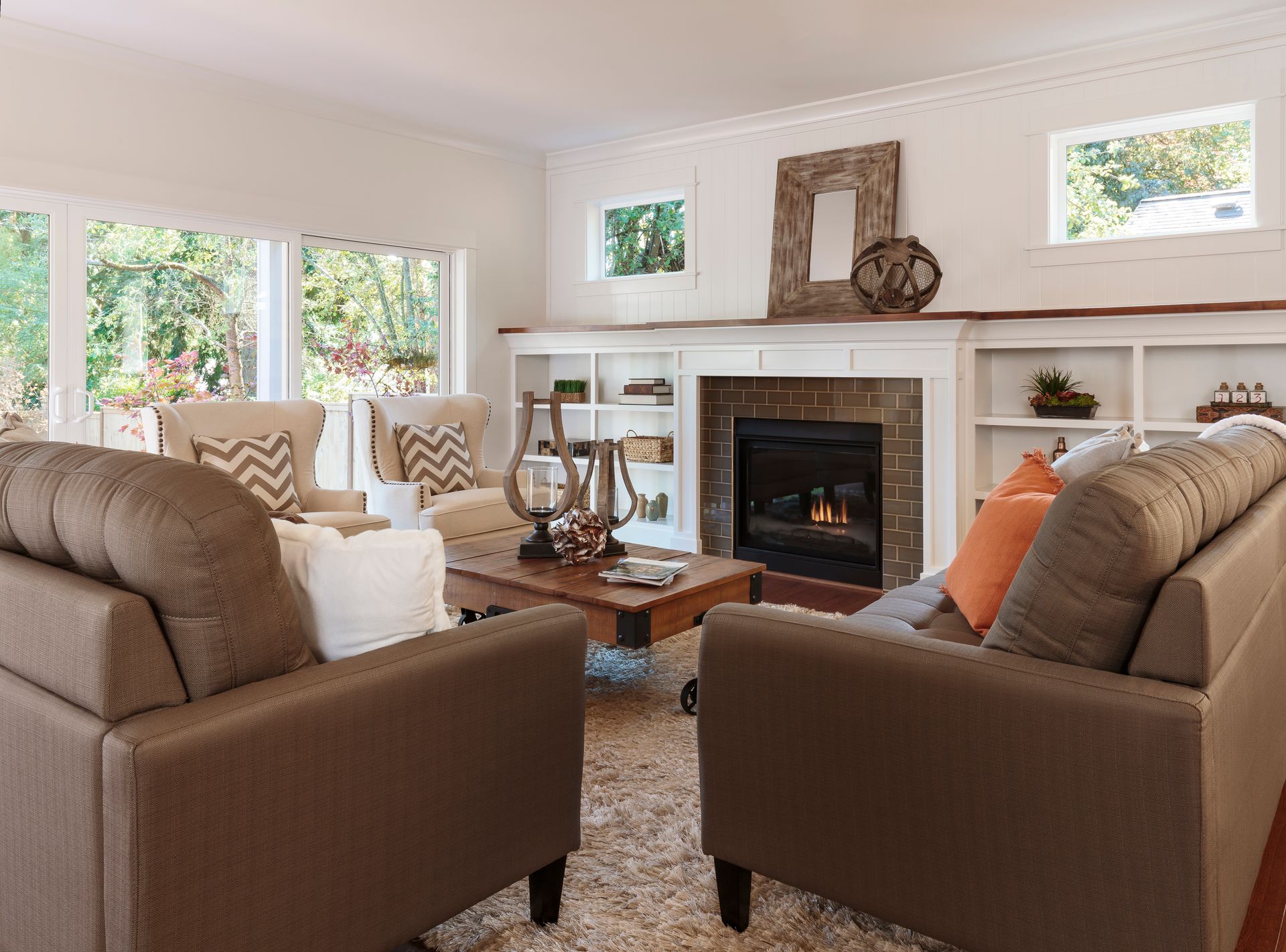 A living room with two couches and a fireplace