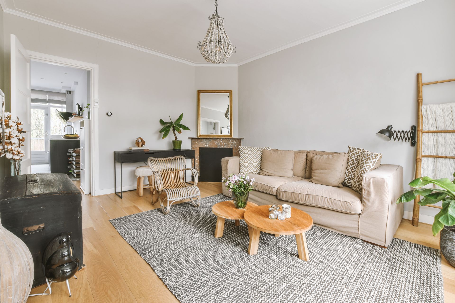 A living room with a couch , two coffee tables , and a fireplace.