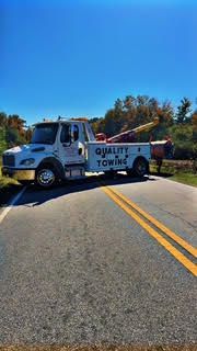 Tow truck on a road with 