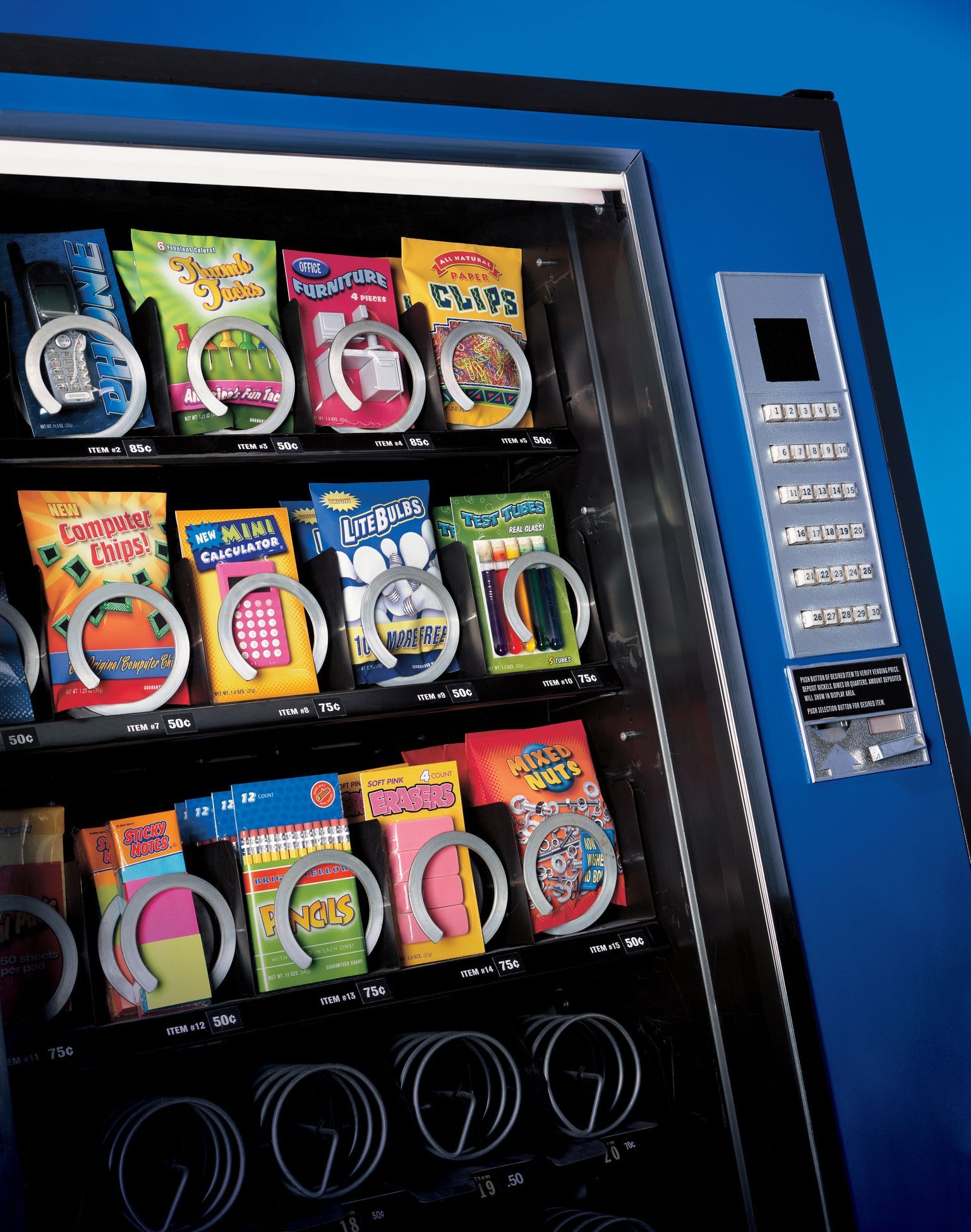 Blue vending machine filled with snack bags. Silver coin acceptors and selection buttons on the side.