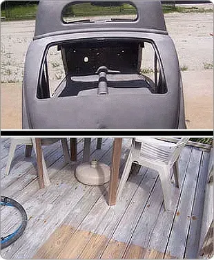 A car is sitting on a wooden deck next to a table and chairs.