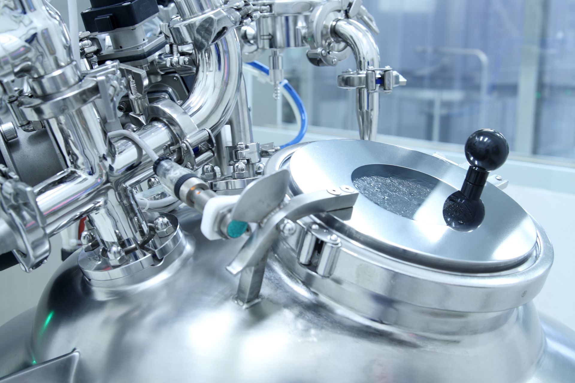 A close up of a stainless steel tank in a laboratory.