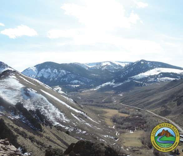 A valley with mountains in the background and a logo that says lone pine valley