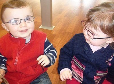 A Little Girl Is Getting Her Eyes Checked by An Ophthalmologist — New Look Eyewear In Maitland, NSW
