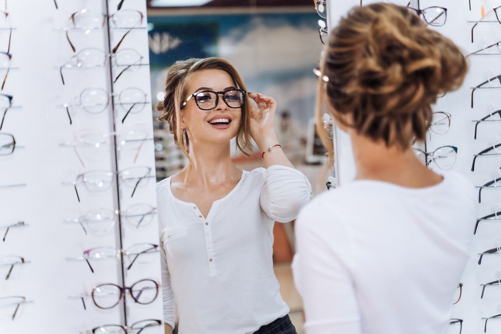 A Group of Hairdressers Are Posing for A Picture in A Salon — New Look Eyewear In Maitland, NSW