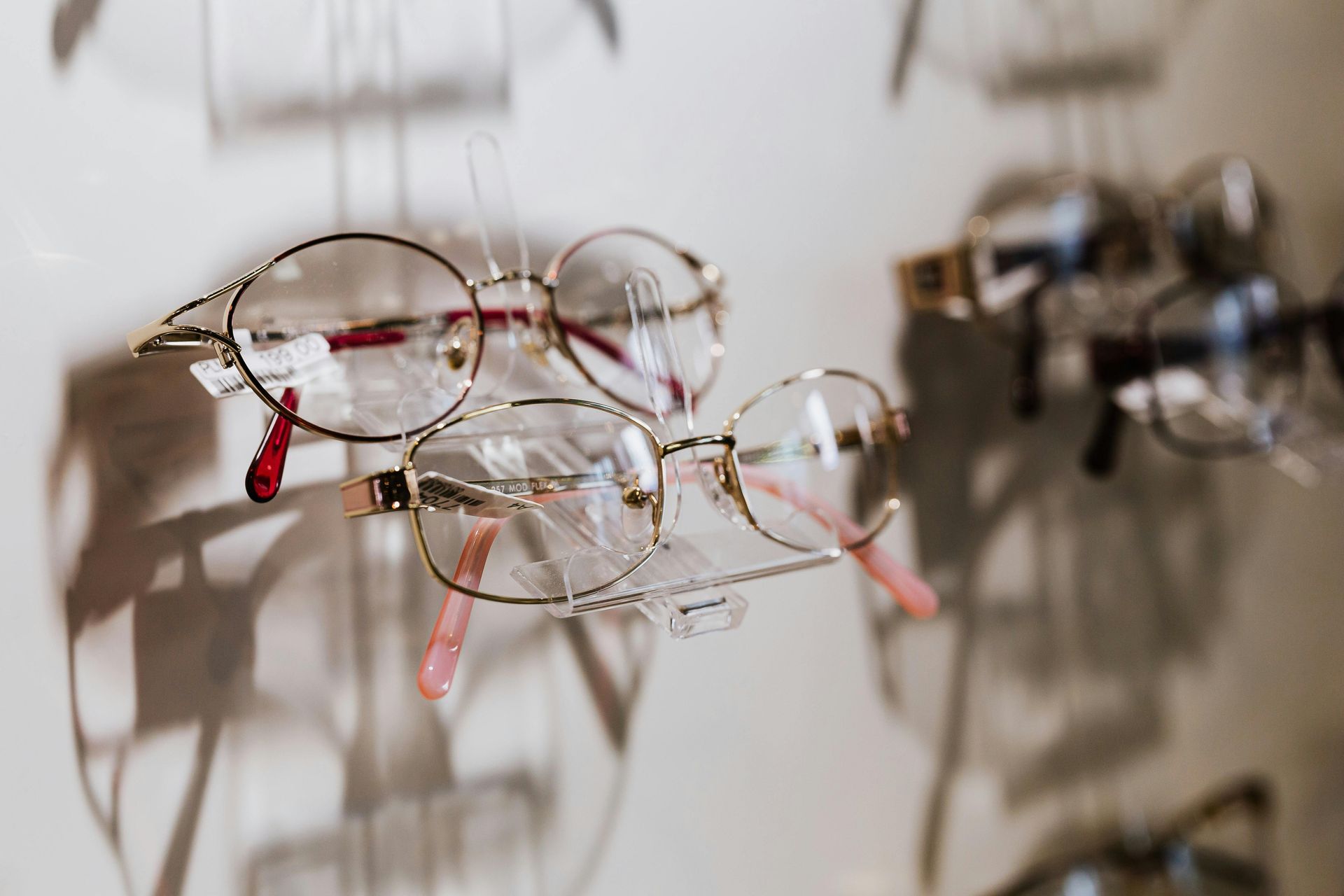 Display of eyeglasses on a wall rack.— New Look Eyewear In Maitland, NSW