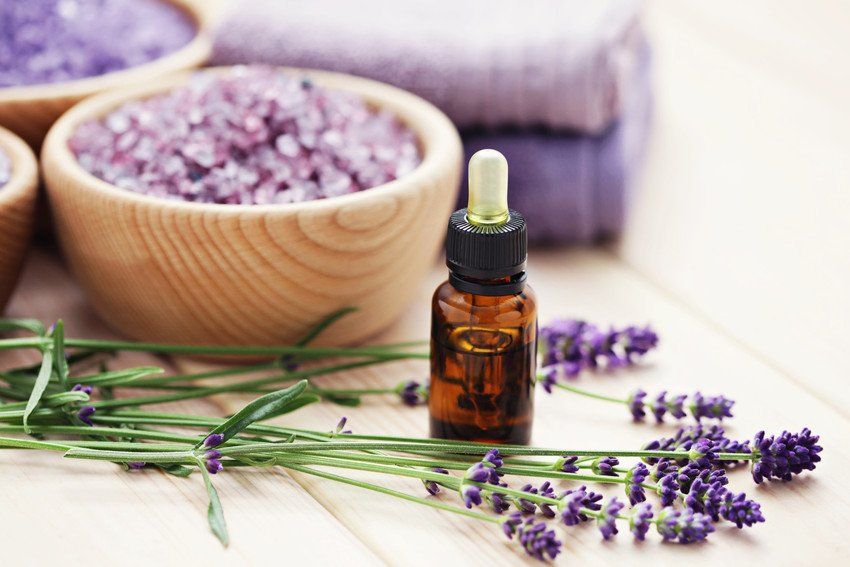 Aromatherapy oil and bowl of lavender bath salt