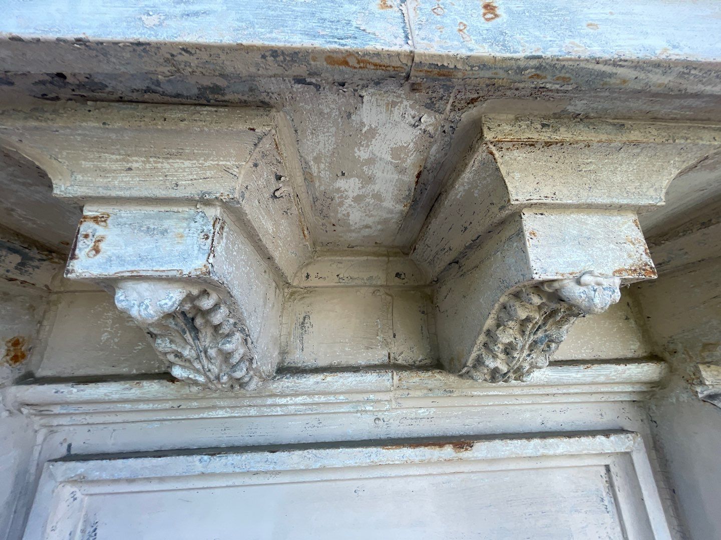 A close up of a building with a ceiling and a door.
