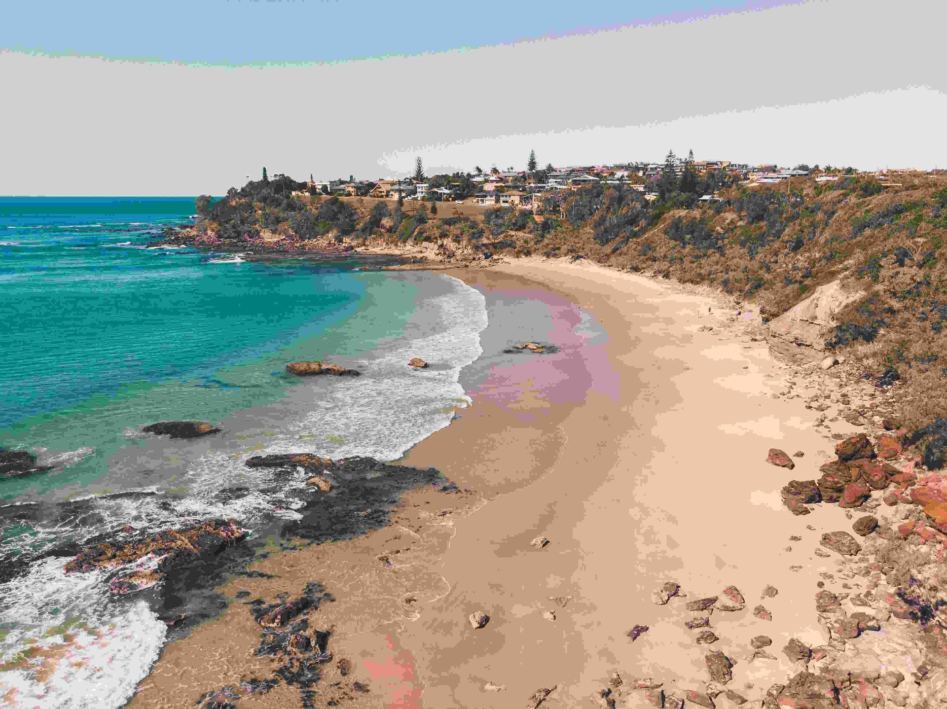 An Aerial View Of A Beach With A City In The Background — Port Denture Clinic In Port Macquarie, NSW