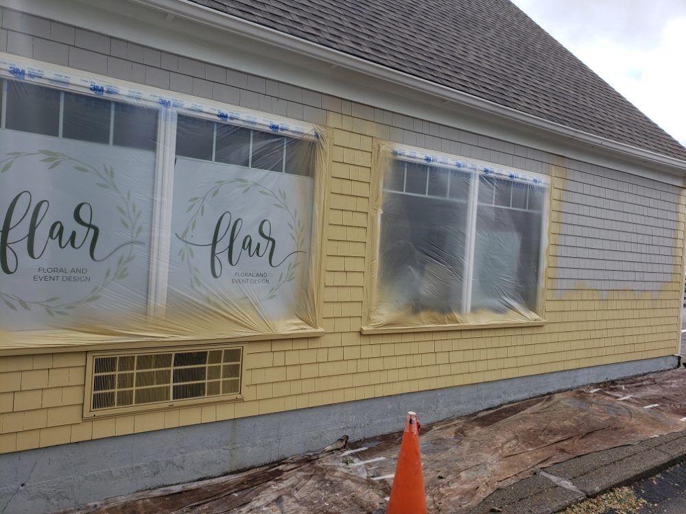 Nkomo Painting & Contracting | A building with a sign that says flair on it