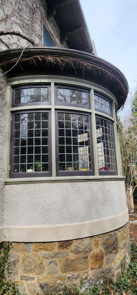 Nkomo Painting & Contracting | A large curved window on the side of a building.