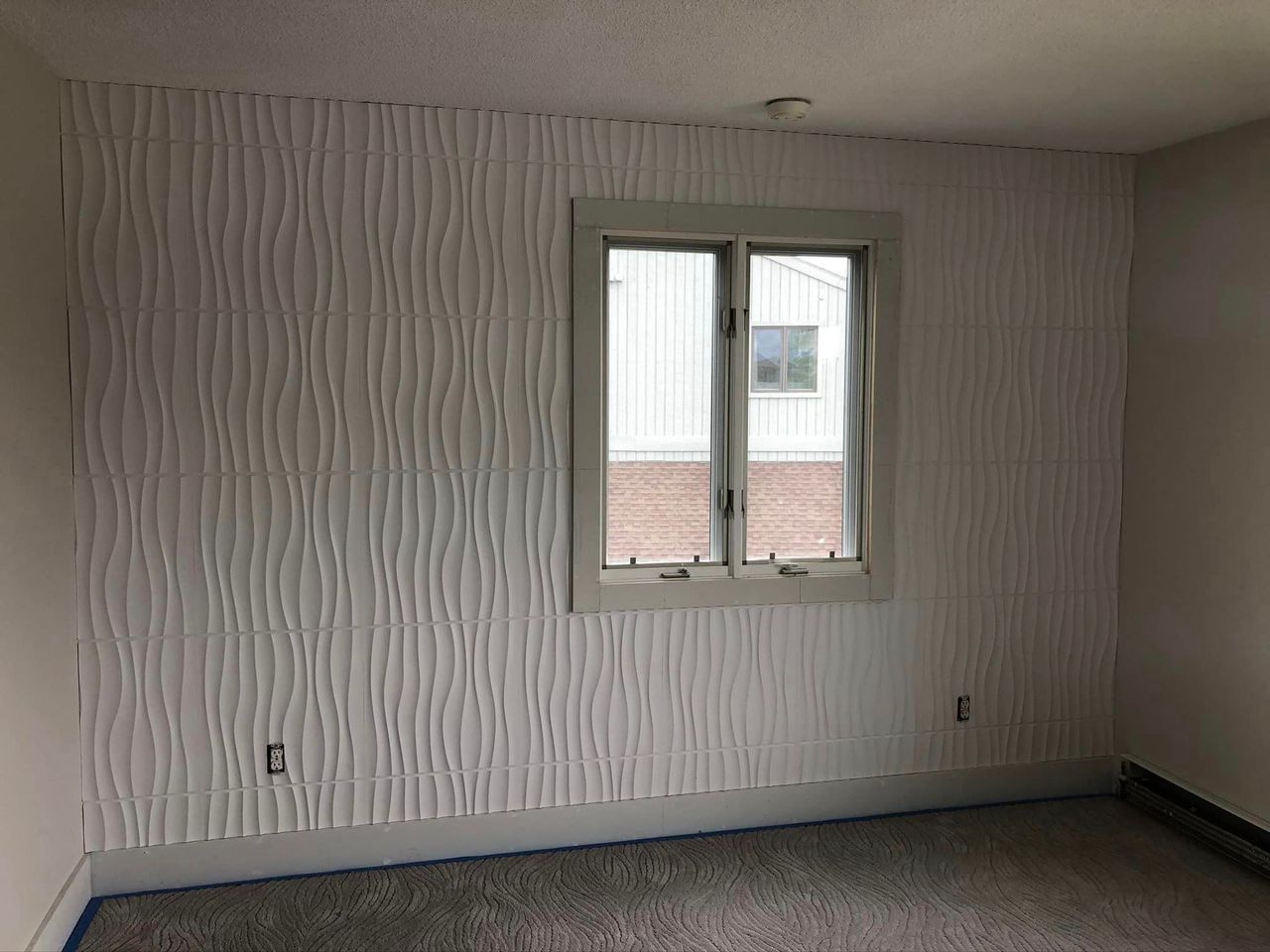 There is a window in the middle of the room.