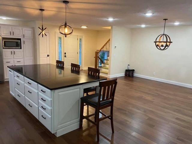 There is a large island in the middle of the kitchen.