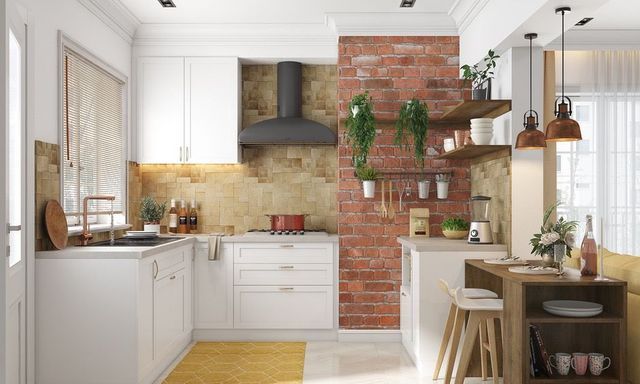 A kitchen with white cabinets and a brick wall.
