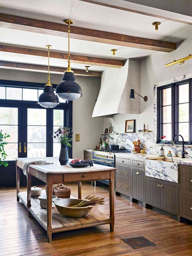 A kitchen with a large island in the middle of the room.