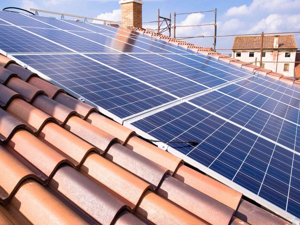 A roof with a lot of solar panels on it