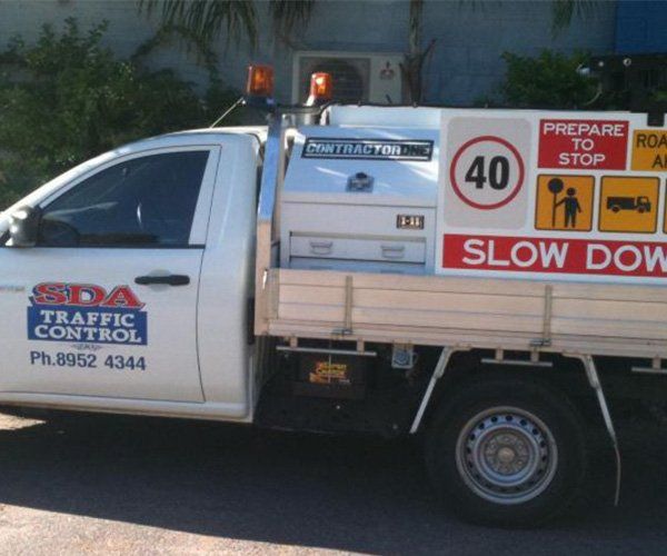 A Service Truck With Traffic Signages  — SDA Plumbing in Alice Springs NT