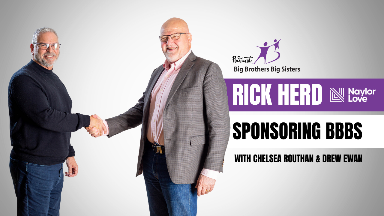 Two men are shaking hands in front of a banner that says rick herd sponsoring bbs.