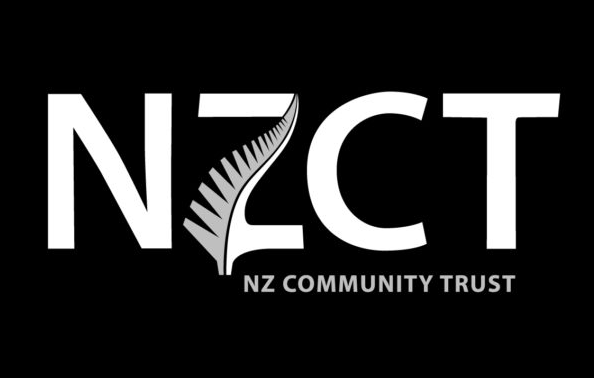 The logo for the nz community trust is white on a black background.