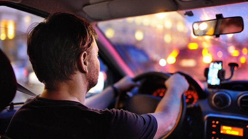 Guy driving a car with blurred vision