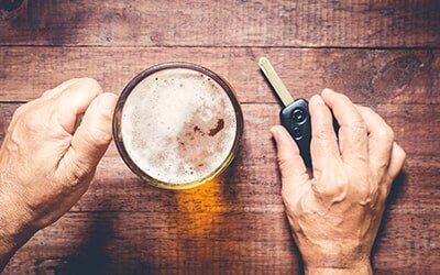 Man Portraying Drink and Drive — Driving While Intoxicated in Leawood, KS