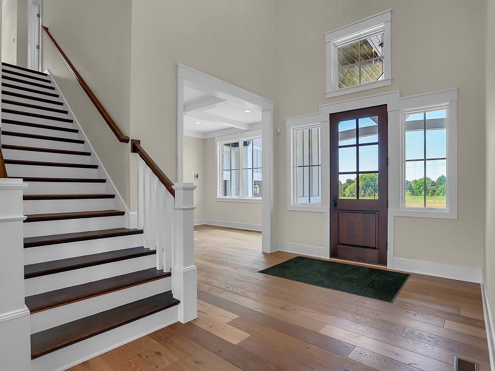 There is a staircase leading up to the front door of a house.