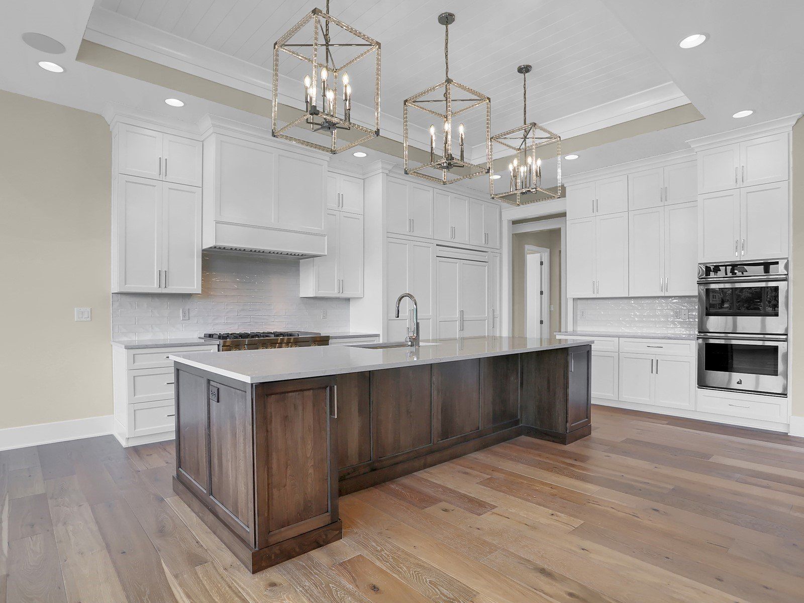 There is a large island in the middle of the kitchen.
