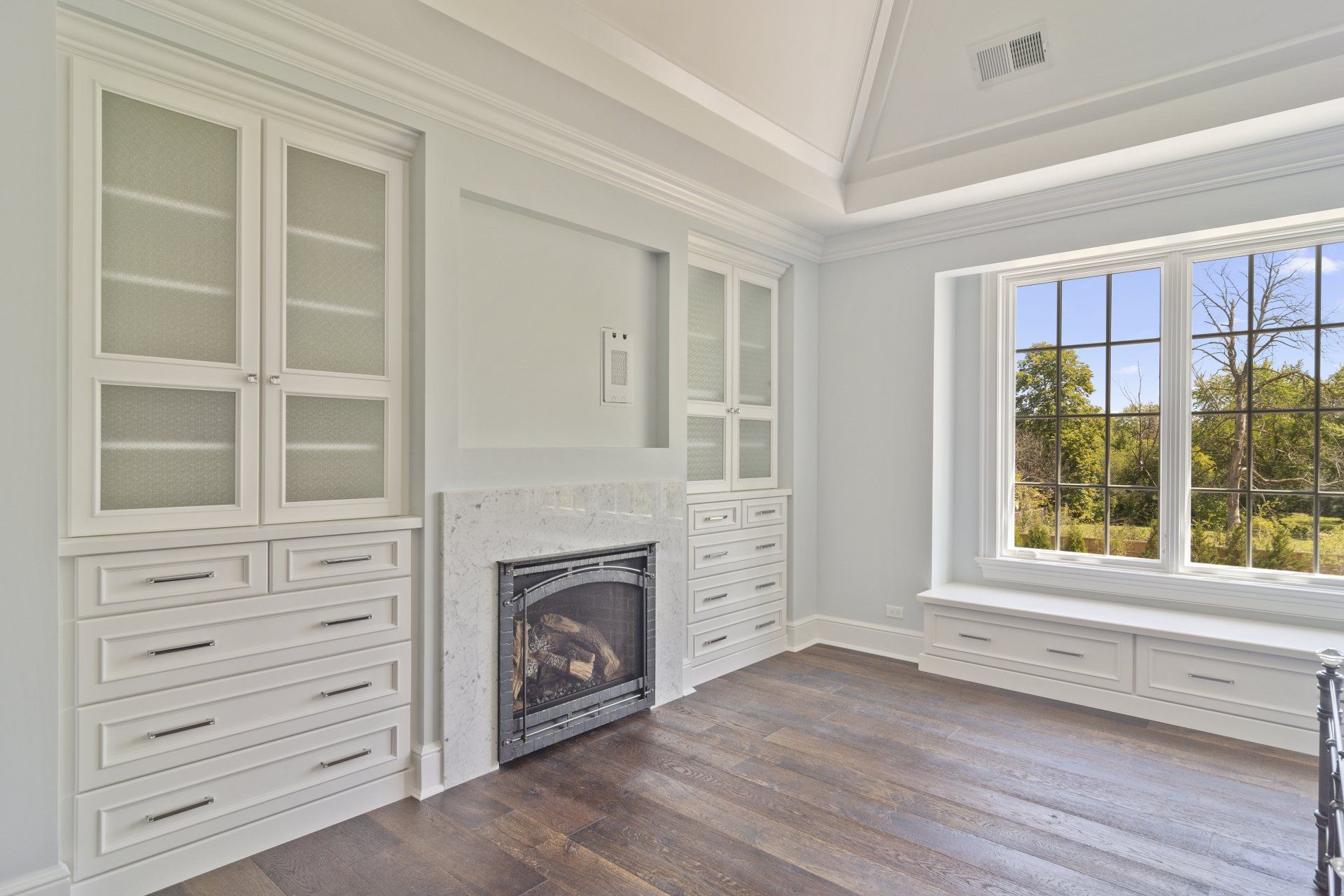 There is a fireplace in the middle of the room.