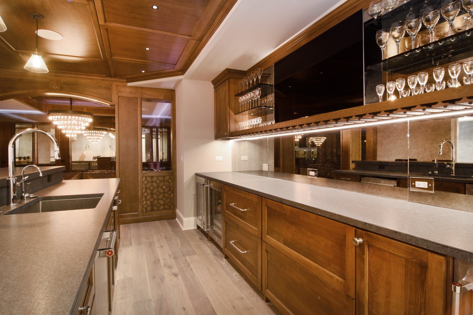 A kitchen with wooden cabinets and a sink