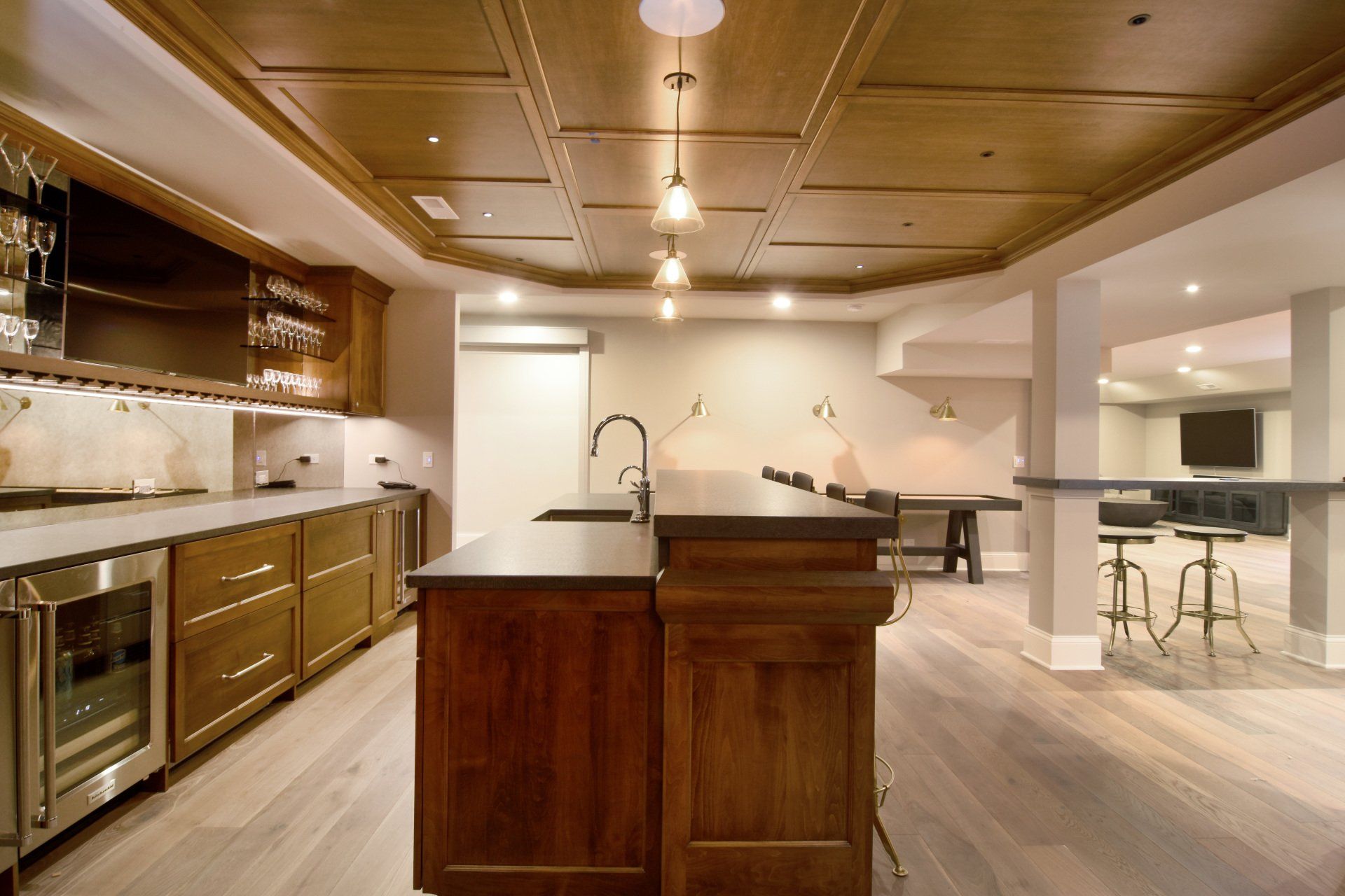 A kitchen with stainless steel appliances and wooden cabinets
