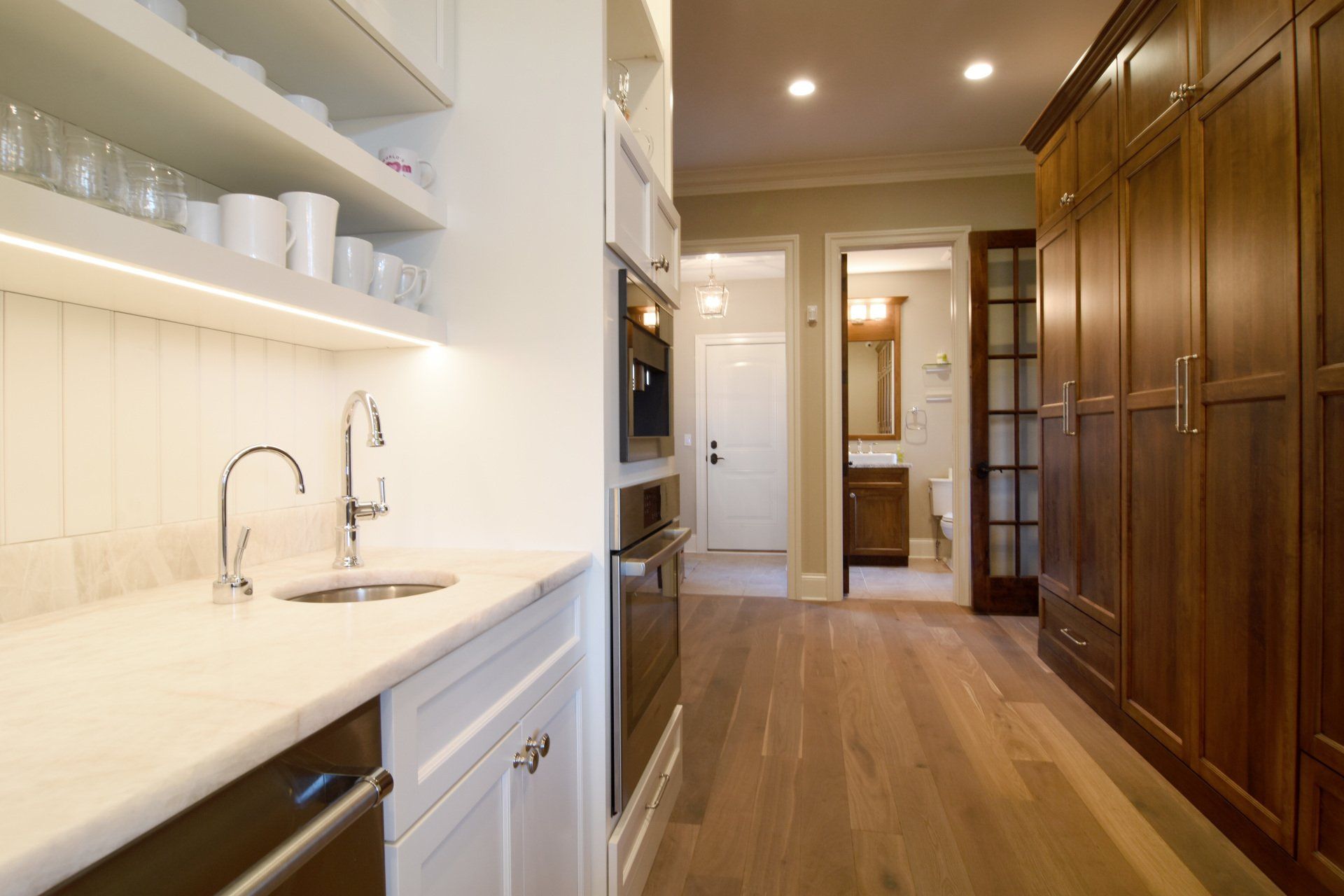A kitchen with wooden cabinets and a sink