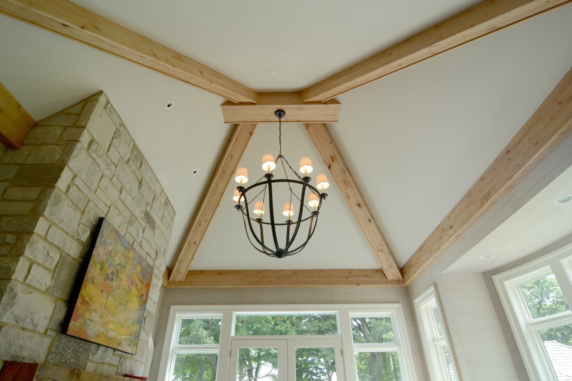 A chandelier is hanging from the ceiling of a living room