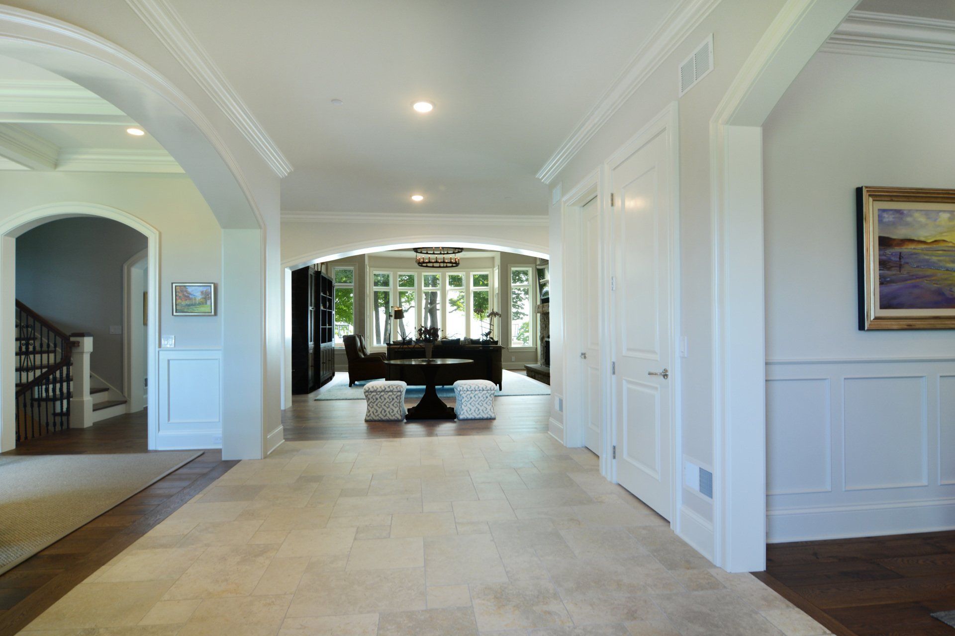 A hallway in a house with a painting on the wall