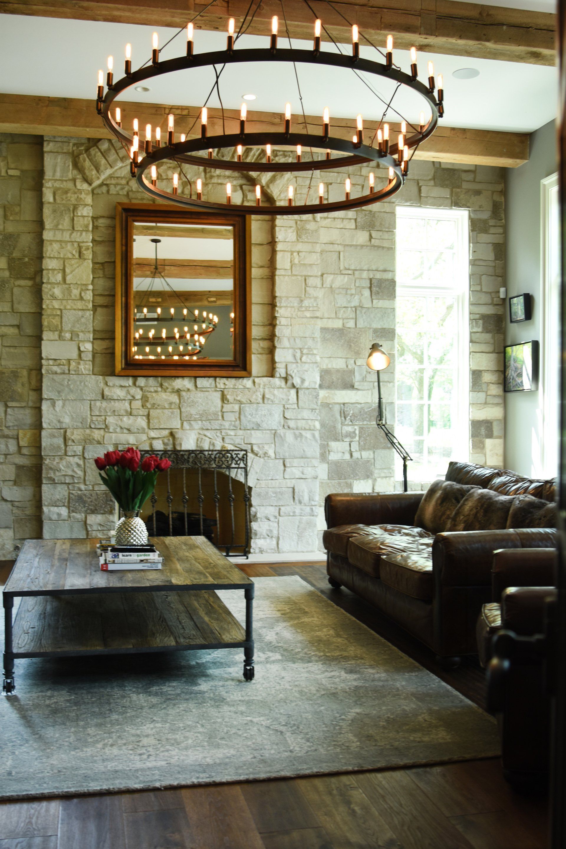 A living room with a couch a coffee table and a fireplace
