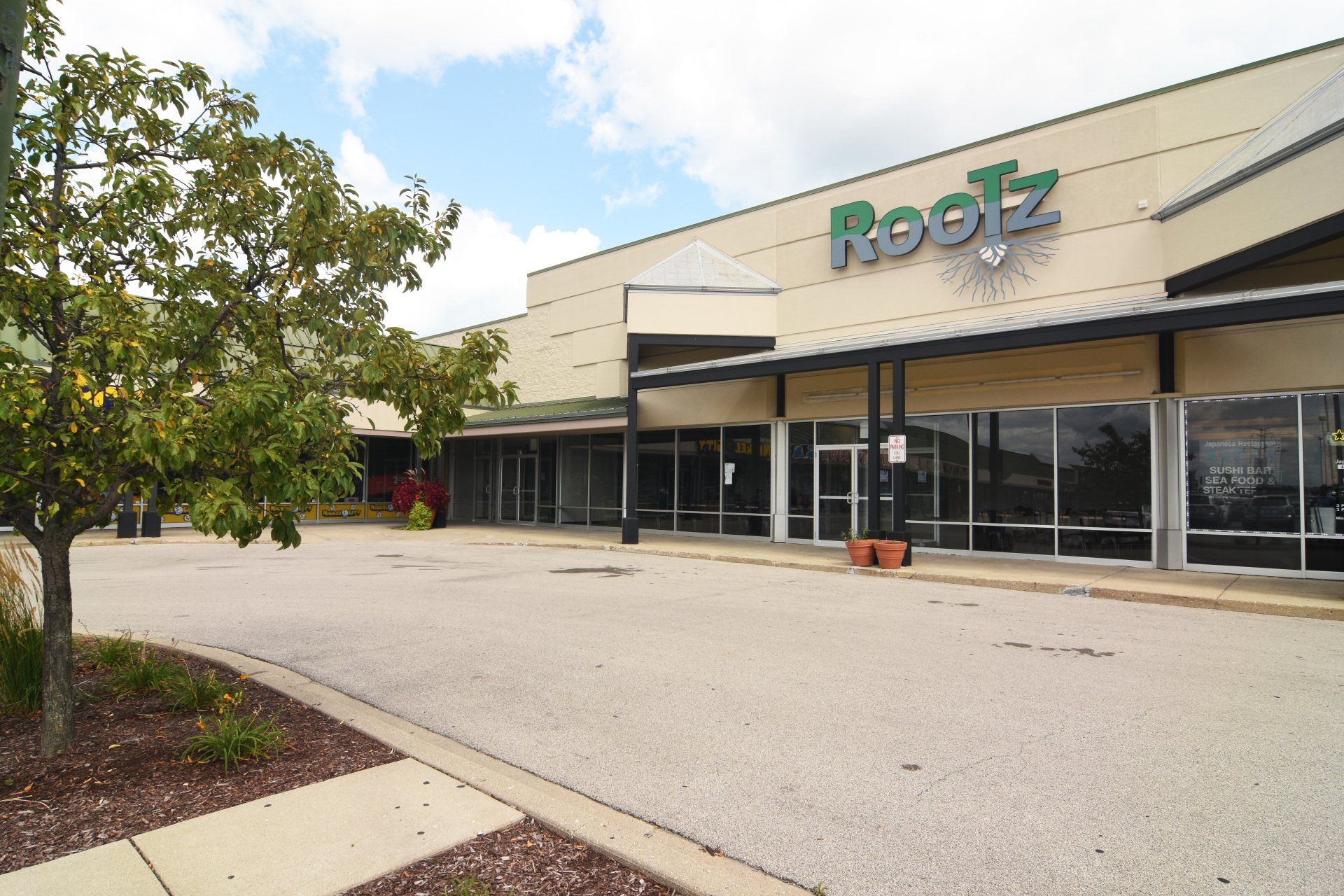 A large building with the word rootz on it