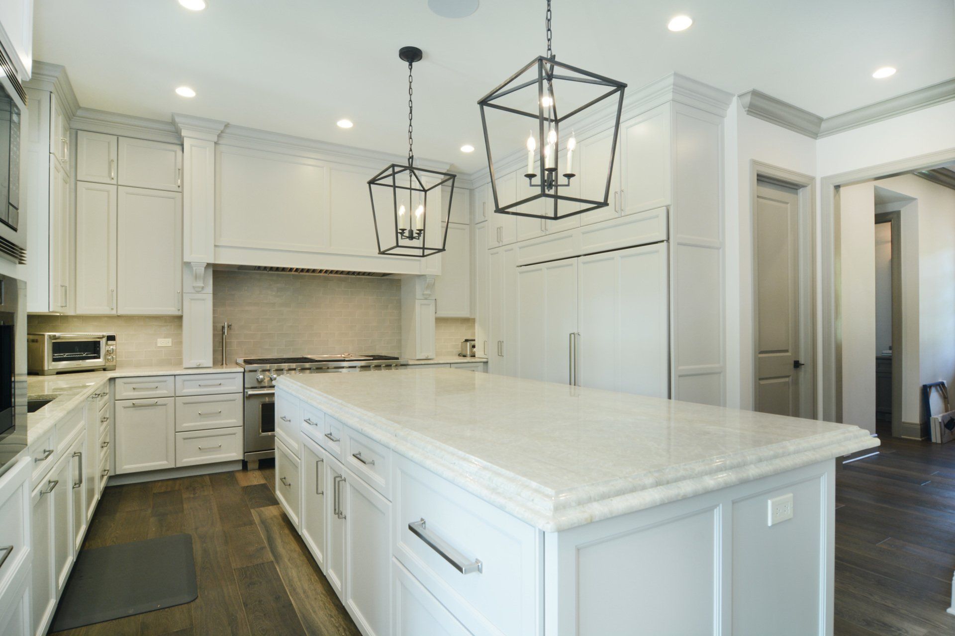 There is a large island in the middle of the kitchen.