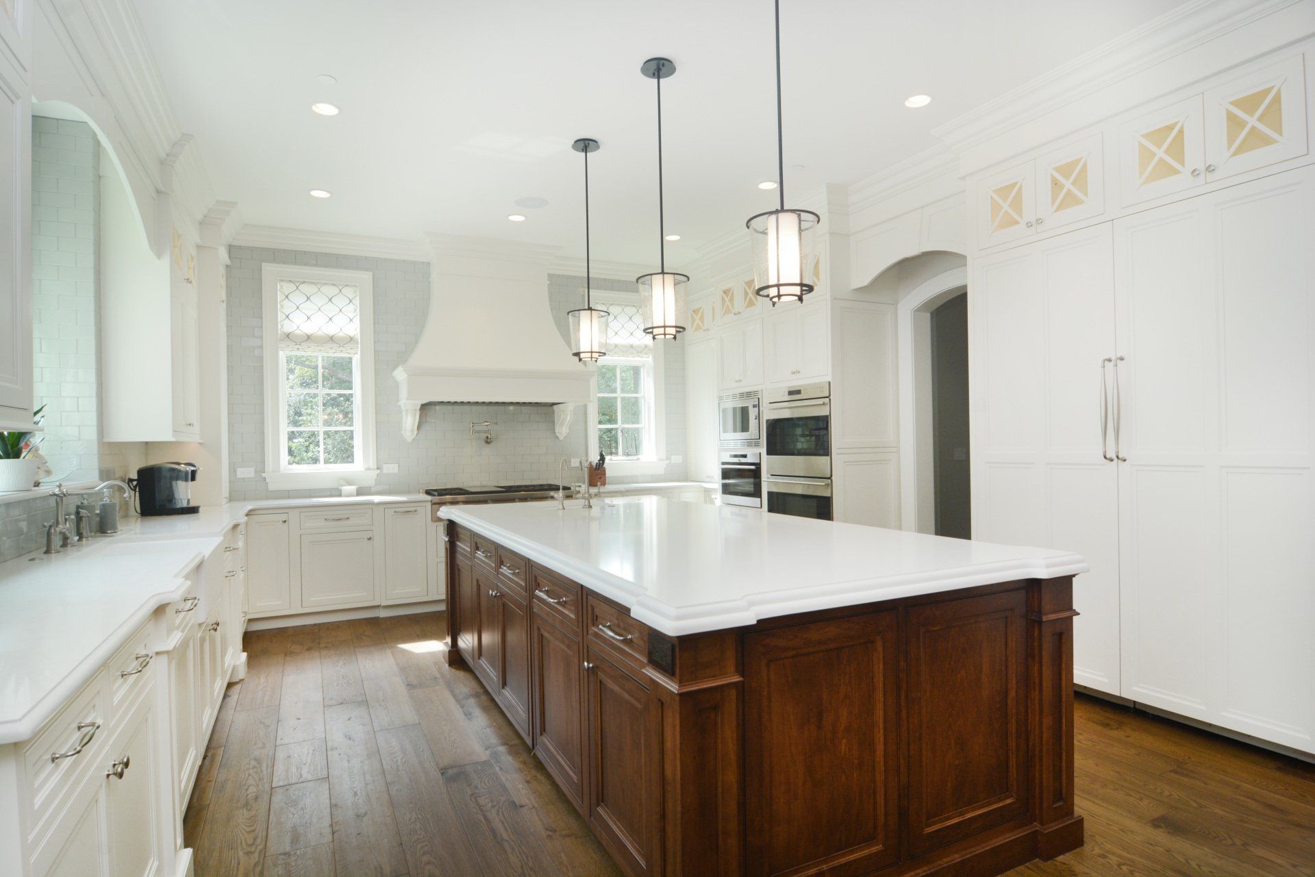 There is a large island in the middle of the kitchen.