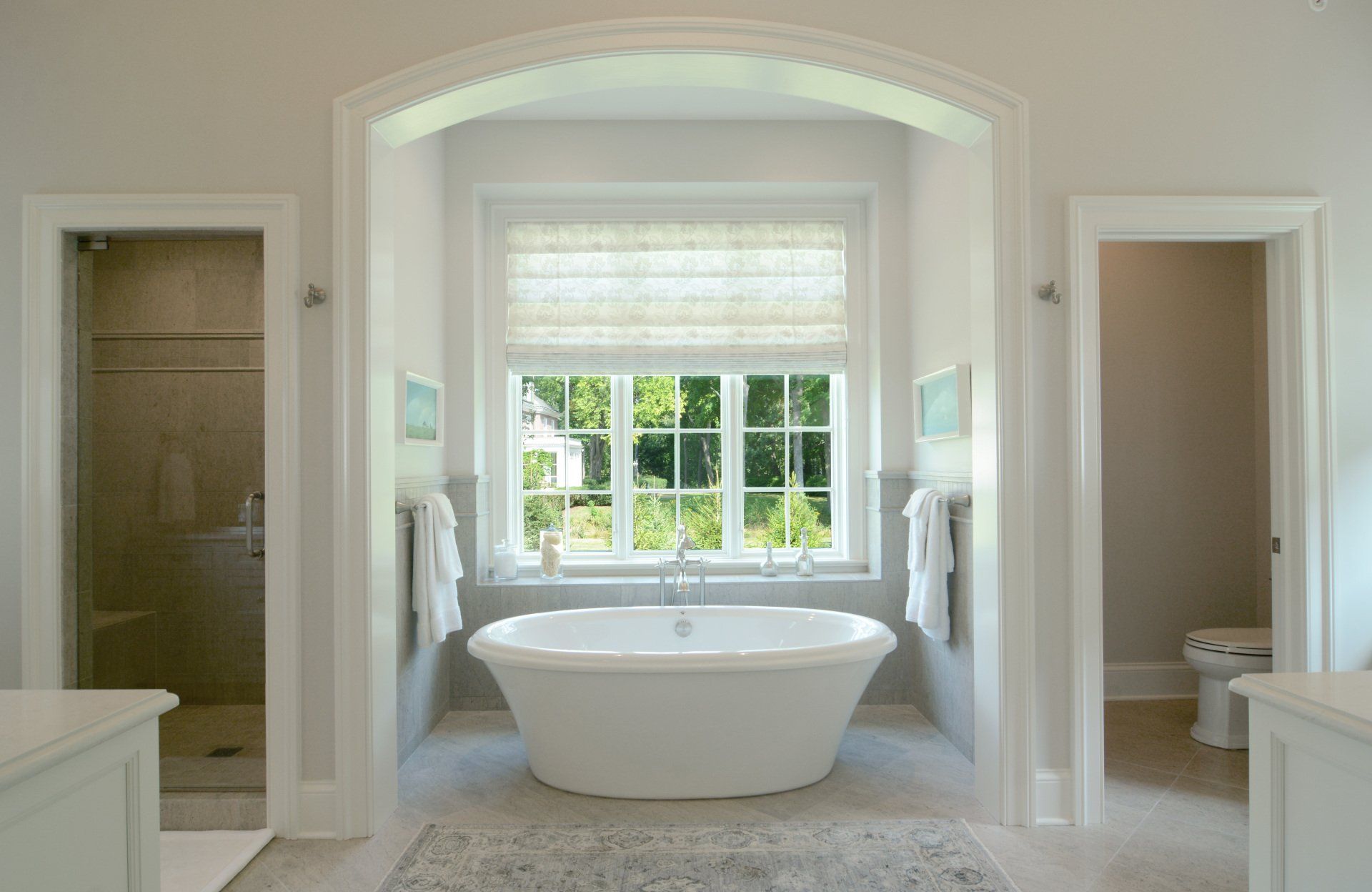 There is a bathtub in the middle of the bathroom.