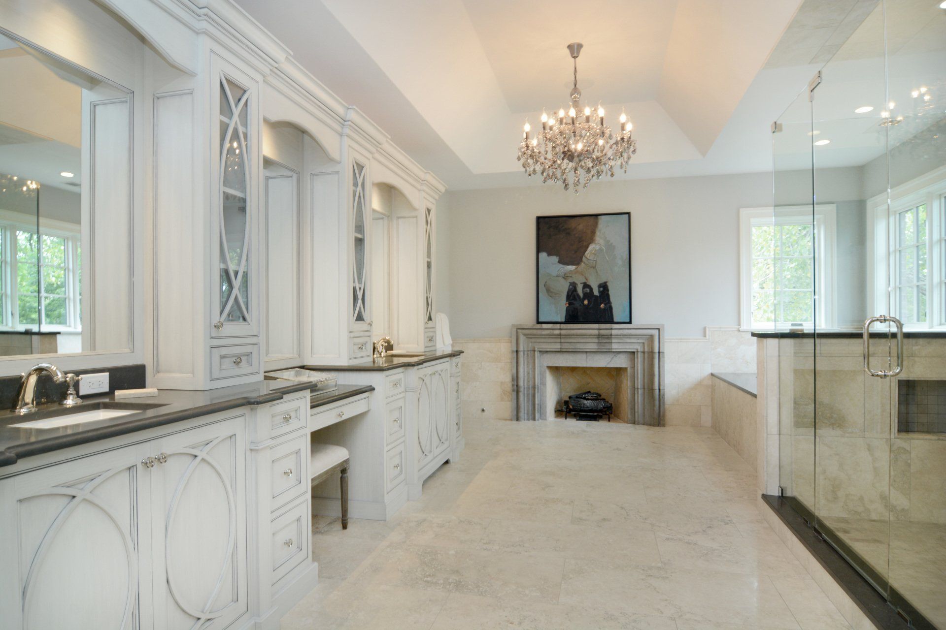 A bathroom with two sinks and a fireplace